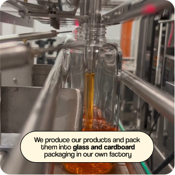 Production of Golden Radiance Body Oil. Overlaid text reads: We produce and package, in glass and cardboard, from our own factory.